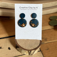Circular Blue Clay Stud Earrings with Flowers